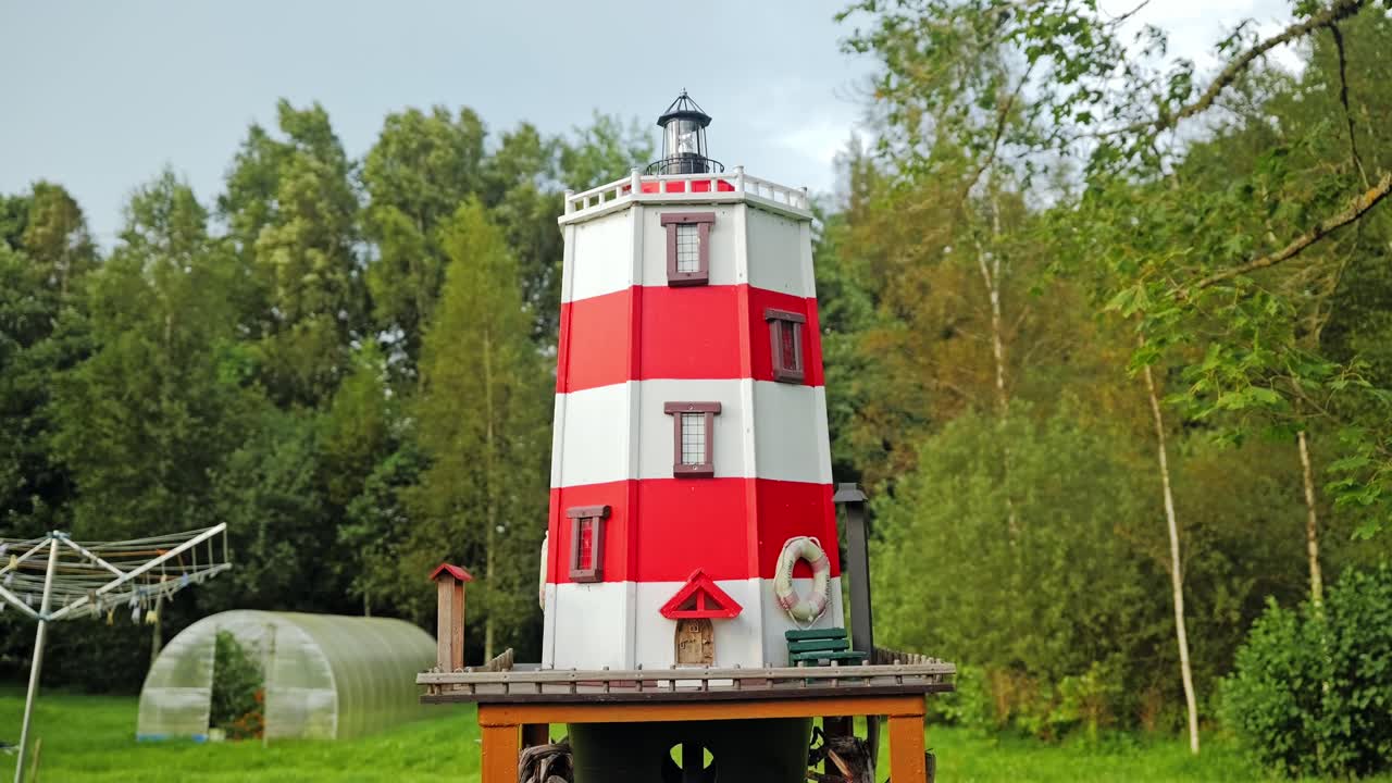 Unique handmade bird feeder built as lighthouse, creativity with nature care