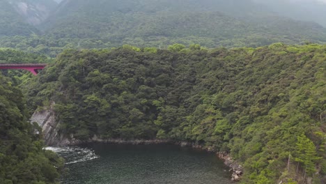 Flying-over-Ocean-towards-Jungles-of-Yakushima,-Japan