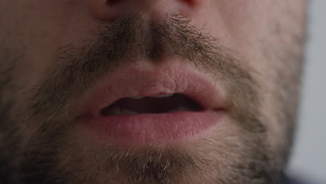 a man using a vape pen inhaling nicotine cannabis or flavoured cbd