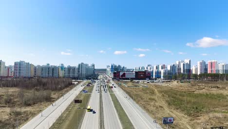 cityscape with highway and shopping mall