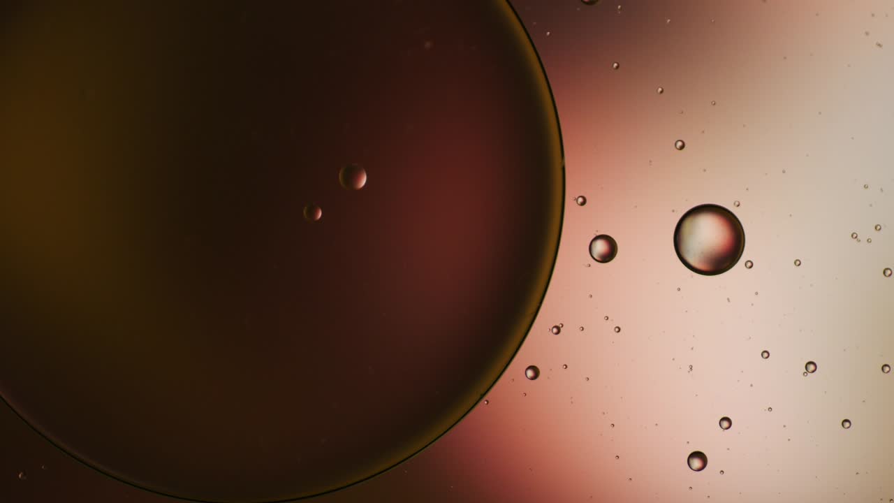 Colorful artistic of oil drop floating on the water.