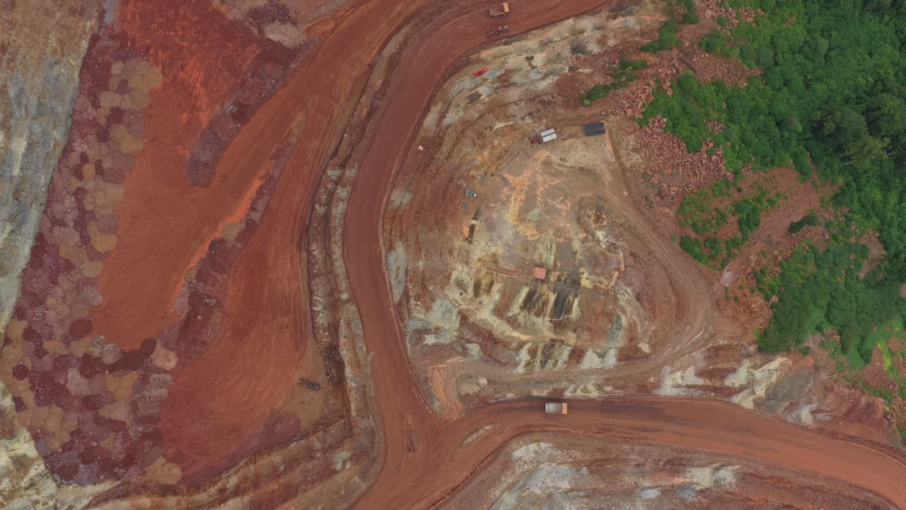 Aerial top down view of open pit bauxite mining quarry