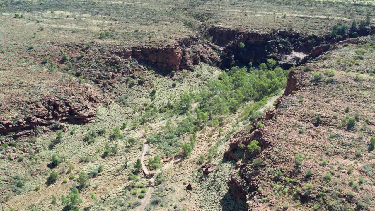 Aerial footage leading towards Kathleen Springs, Petermann, Northern Territory, Australia. August 2022