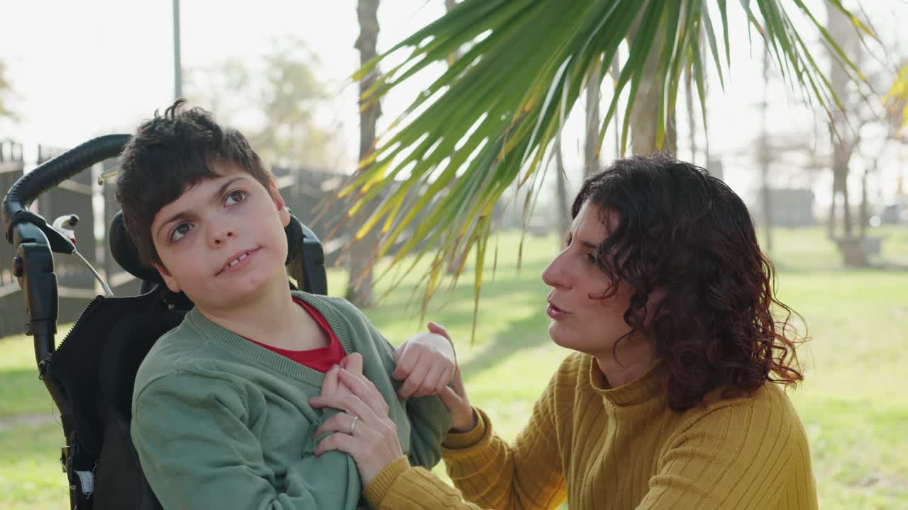 Child in Wheelchair with Caregiver