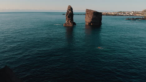 coastal rocks and sea stacks with people