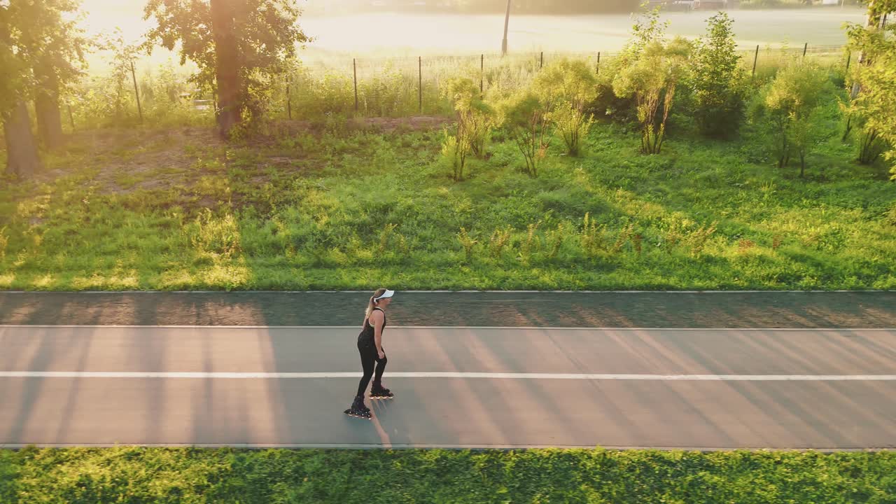 Woman Rollerblading in Park at Sunrise
