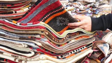 colorful handmade pillows and cushions at a market