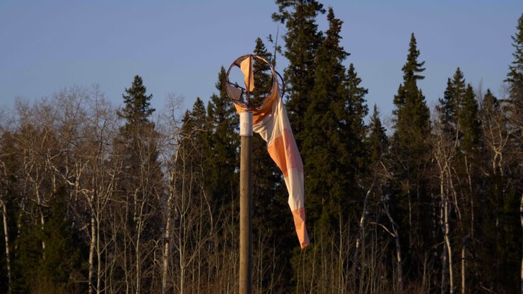 Broken Windbag With Spruce Forest In Background At Fort St