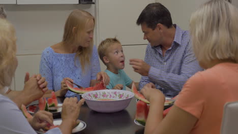 eating watermelon in the dining room