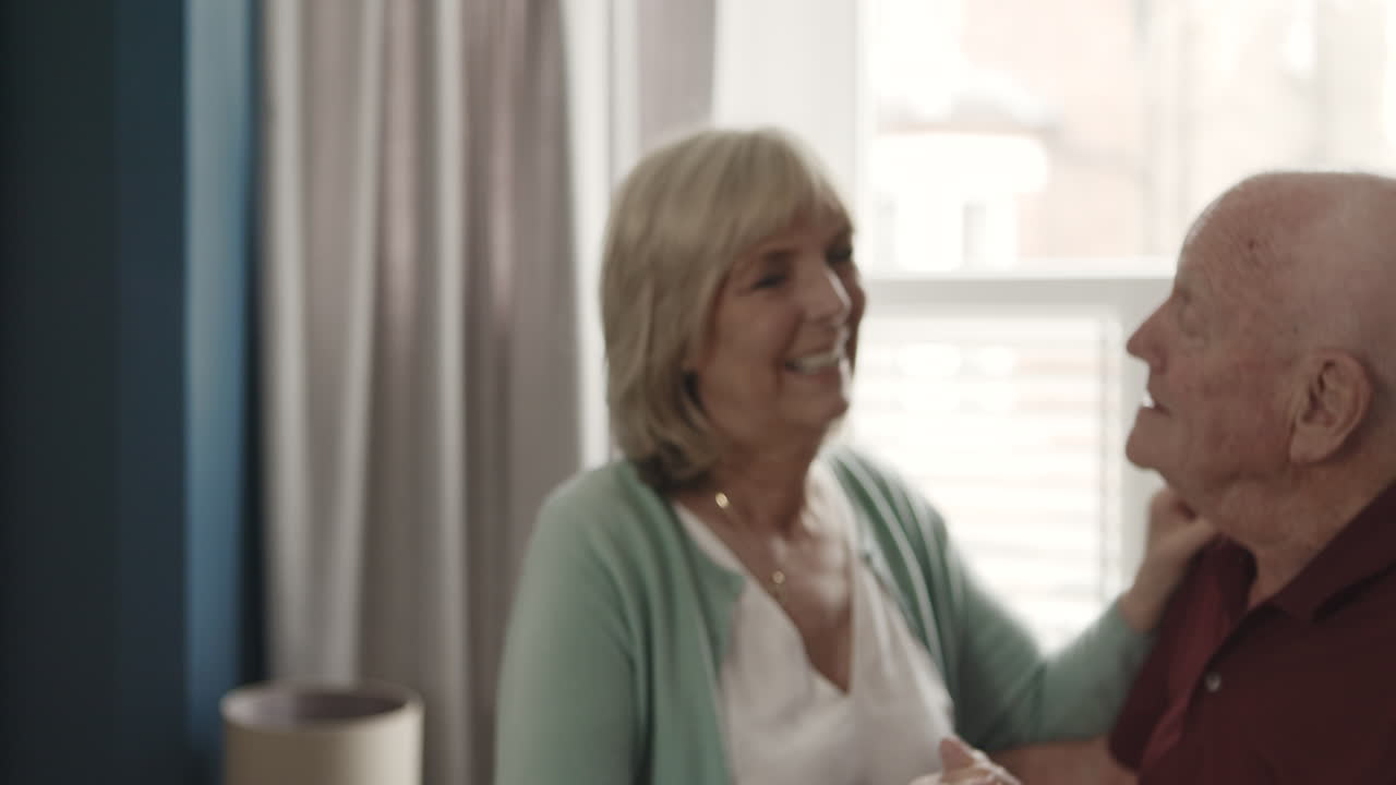 An elderly couple dancing
