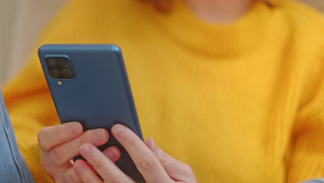 Close-Up-Of-A-Woman-Relaxing-And-Using-Her-Smartphone