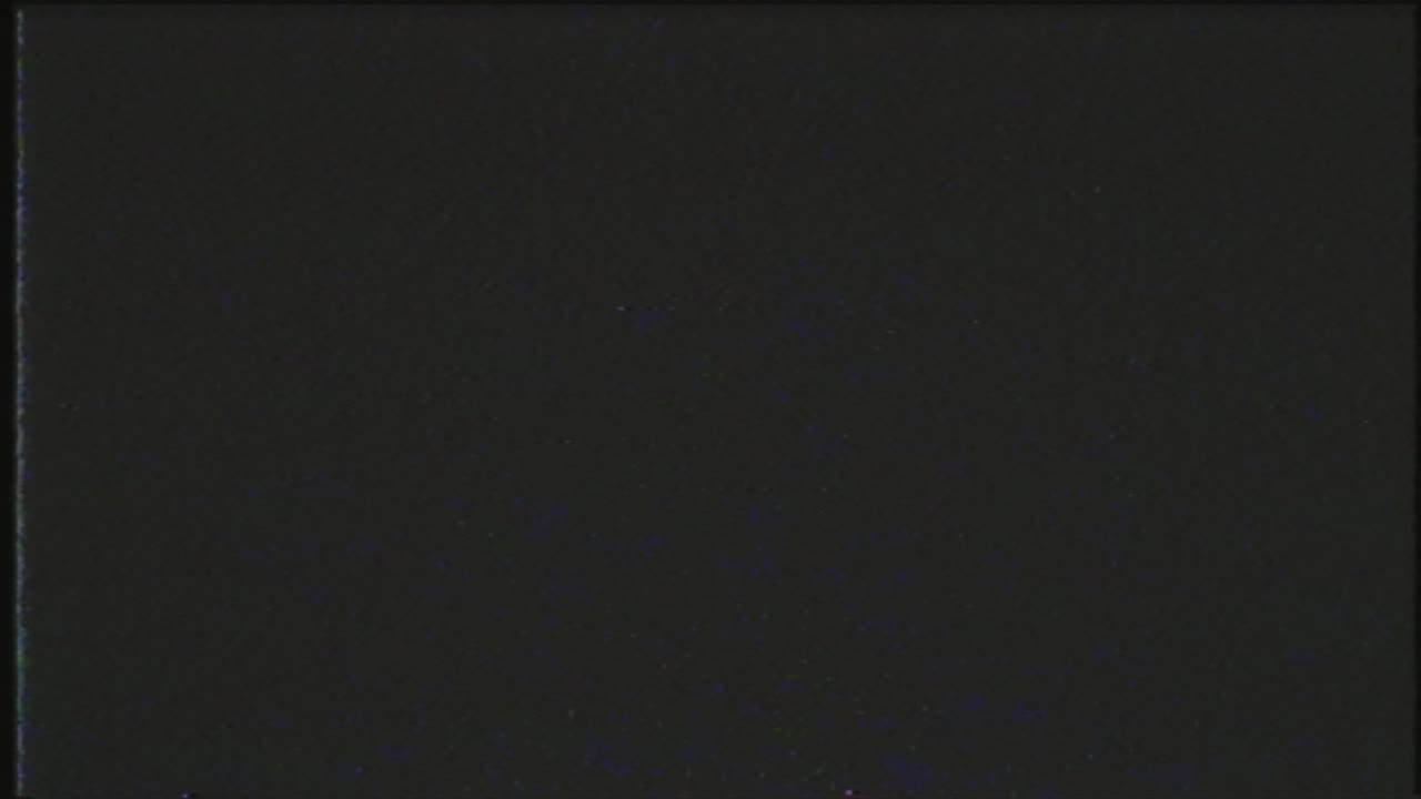 Authentic VHS tape noise with color bleeding, scan lines, and static glitch effects. Seamless loop for creating a retro 80s or 90s television look. Use as an overlay or background