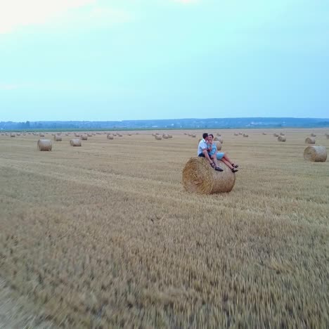 couple near haystack at countryside