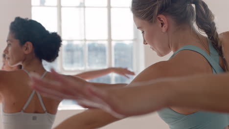 yoga class beautiful caucasian woman practicing reverse warrior pose fitness instructor teaching group of multi ethnic women healthy meditation practice in workout studio