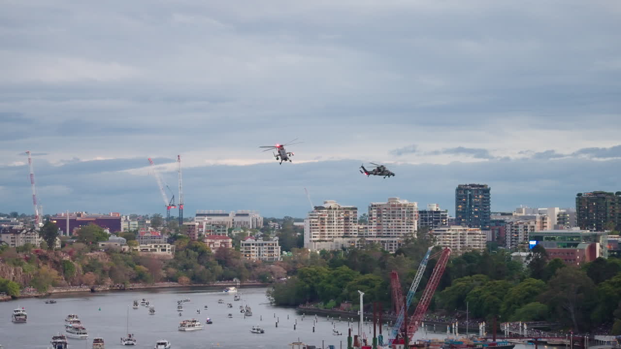 Formation Of Military Helicopter Convoy Flying Over Brisbane City River During Riverfire, 4K Slow Motion