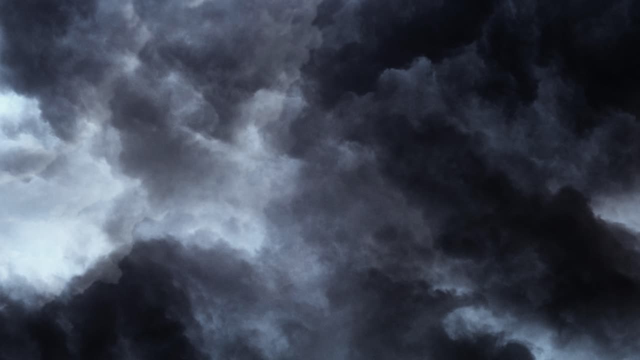 4k view of thunderstorm in moving dark cumulonimbus clouds