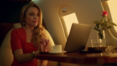 relaxed executive looking window in golden sunlight. closeup happy blonde rest