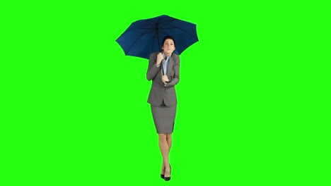 businesswoman standing under umbrella