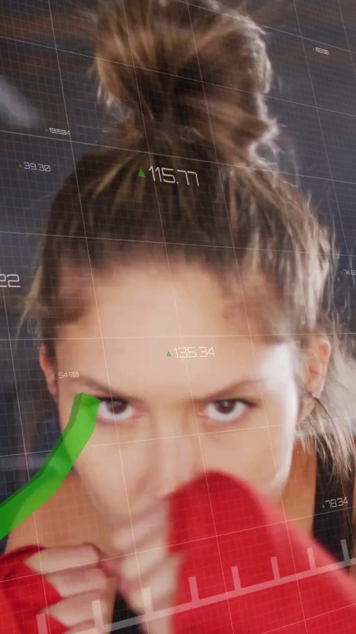 Vertical video: Female athlete initiating shadowboxing, throwing jabs, blocks, HUD tracking fitness