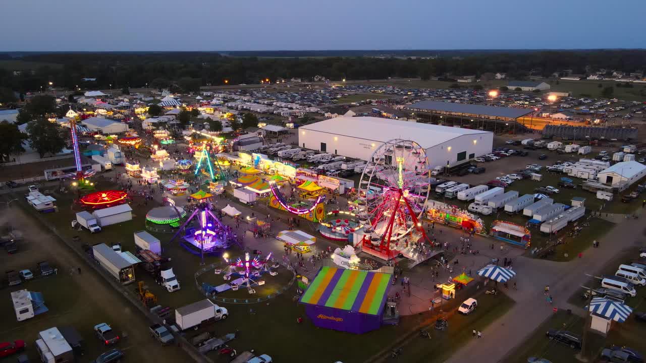 Glowing amusement park in countryside of Michigan, USA, aerial view