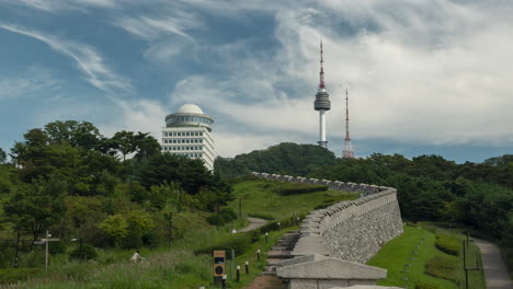 View-of-Namsan-Tower-from-Hanyangdoseong,-the-Seoul-City-Wall-on-Summer-Day,-Traveler-People-Timelapse-Sightseeing-in-a-Park---static