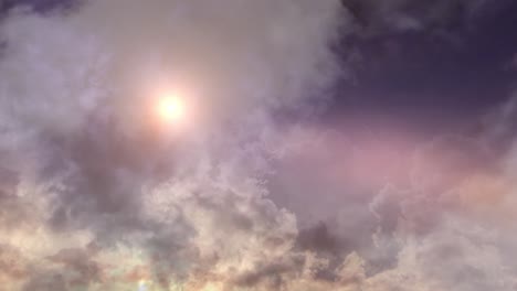 timelapse of the sun behind dark clouds in a blue sky