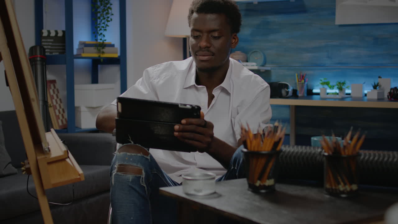 African american man with disability using digital tablet