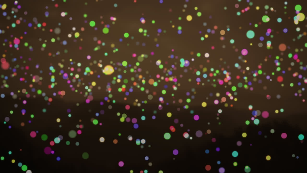 animación de puntos de navidad multicolores que parpadean sobre las montañas en el fondo