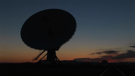 Mediumshot-Of-A-Silhouette-Of-A-Satellite-Dish-In-The-Array-At-The-National-Radio-Astronomy-Observatory-In-New-Mexico