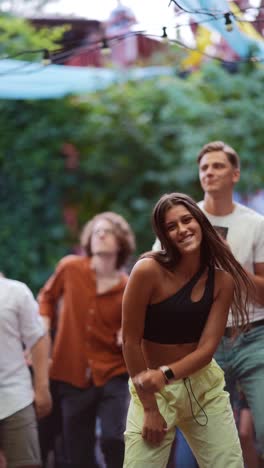 people dancing at an outdoor party