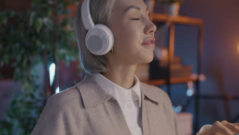 woman enjoying music with headphones