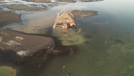 Pullback-Shot-Of-Fishing-Vessel-Clyne-Castle-Steam-Trawler-Wreck---Breidamerkursandur---South-Iceland---Drone-Shot