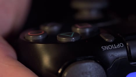 close-up view of a hand using a game controller