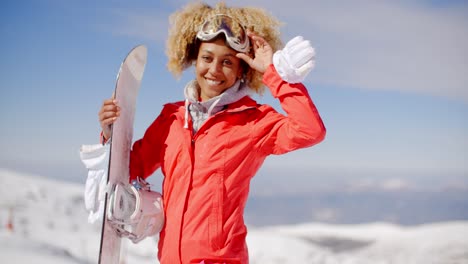 Confident-skier-with-skis-and-gloves-on-hill