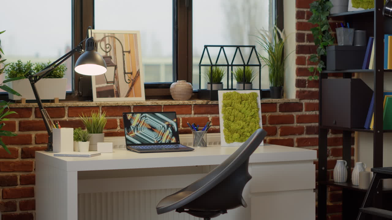 Nobody at empty desk with laptop computer and interior decor