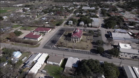 aerial shot over the historic courthouse in johnson city, texas