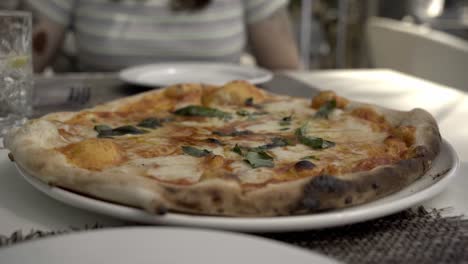 delicious pizza being severed in a spanish restaurant