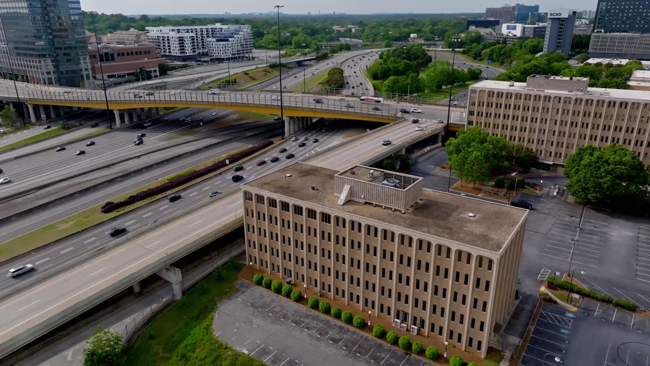 Horace E Tate Freeway traffic movement, Downtown connector green space and commercial buildings, Drone shot
