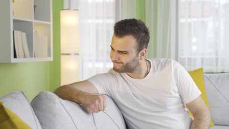 young man with mental disorder is aggressive at home.