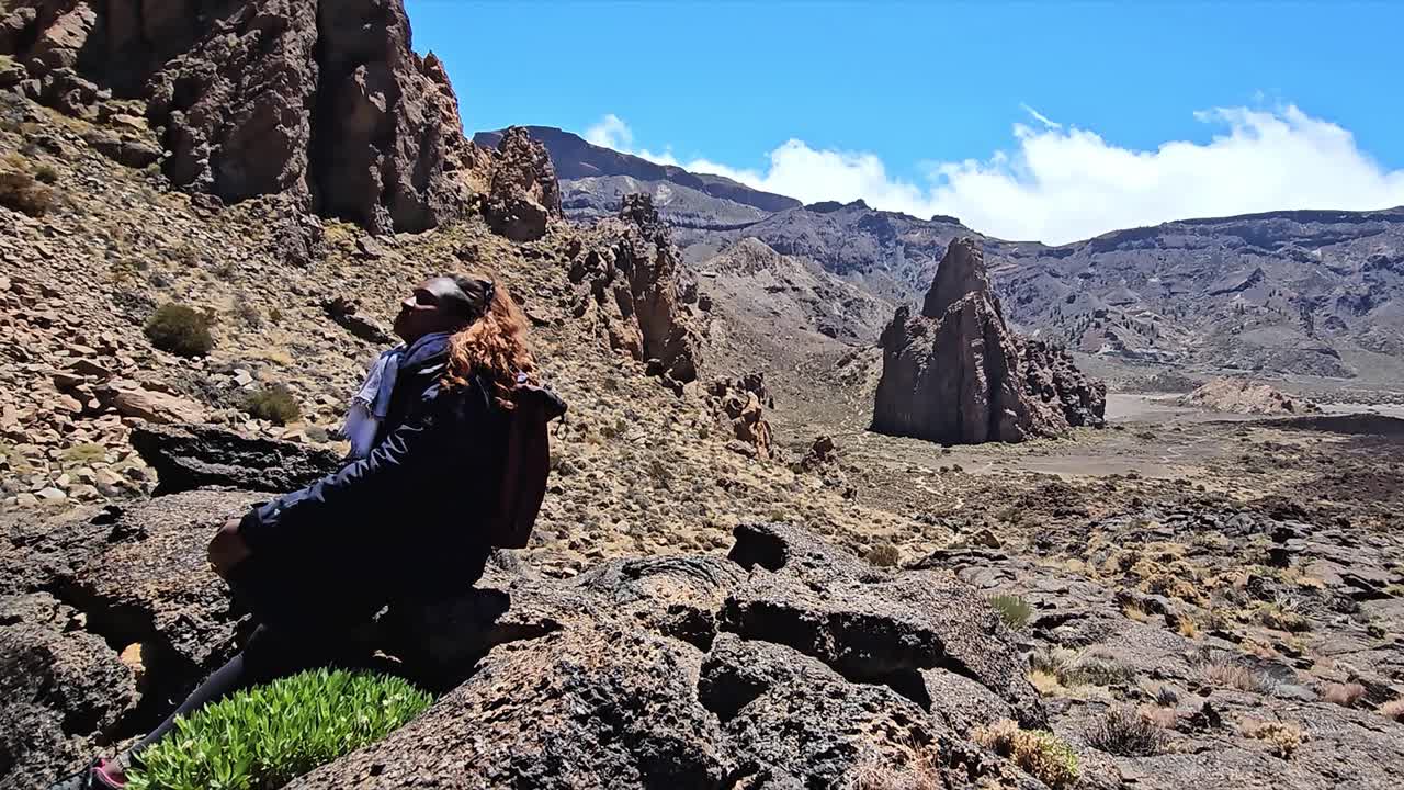 Rock formations in the Teide National Park, Tenerife, with a person exploring the landscape