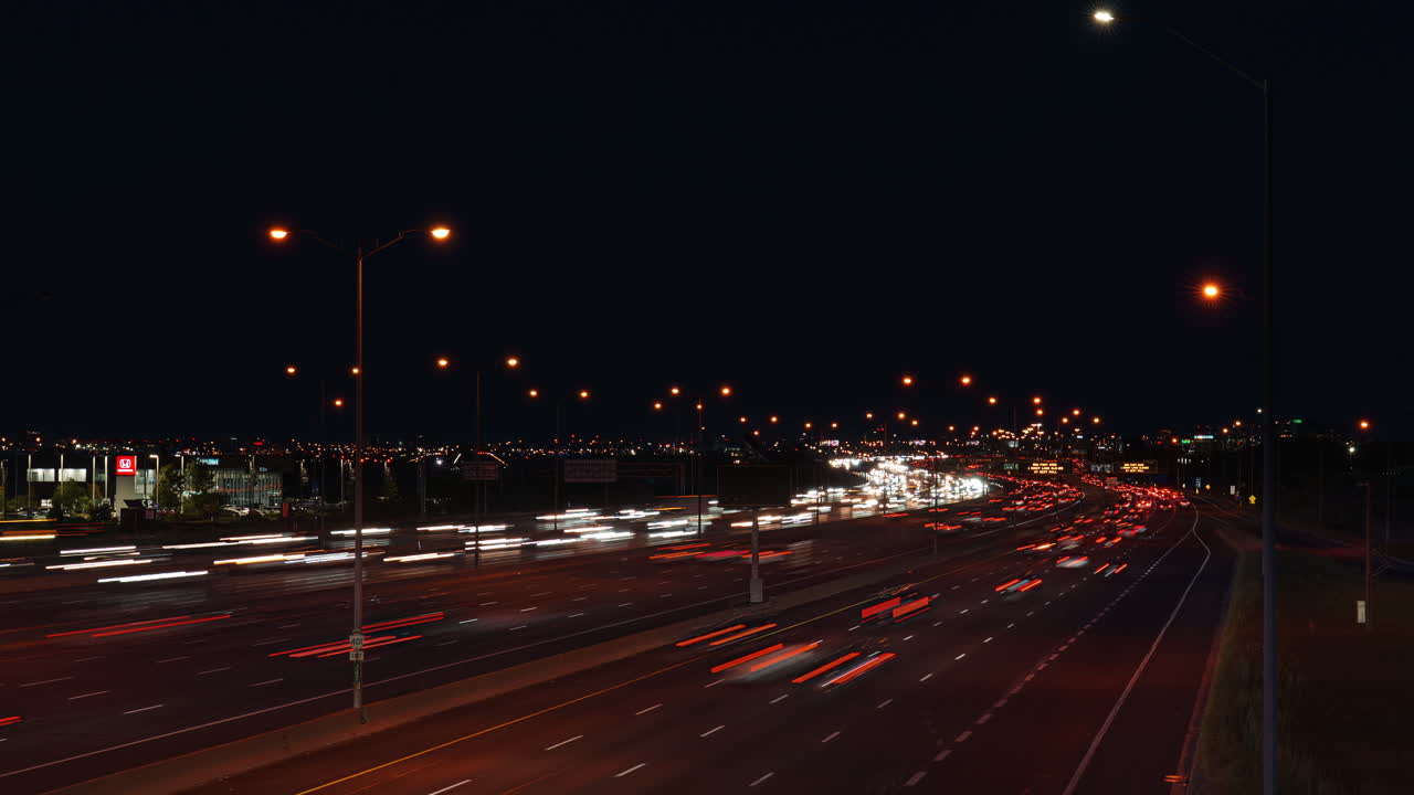 Nighttime timelapse of busy Highway 401 Ontario, Canada, vibrant lights