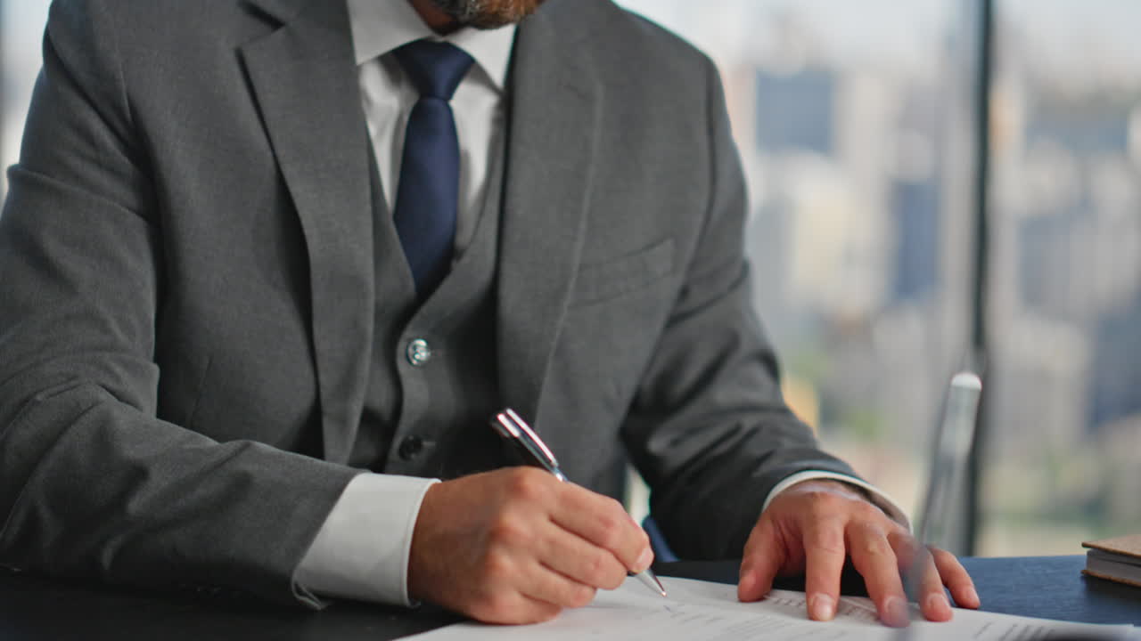 Closeup hands signing contract at desk. Confident boss thinking planning future