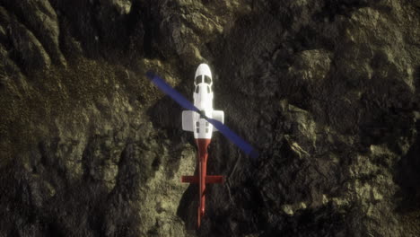 helicopter hovering above rocky terrain in a remote location
