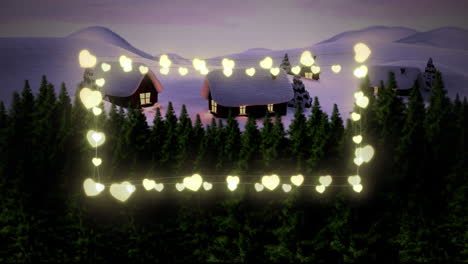 luces de hadas en forma de corazón amarillo contra el paisaje de invierno con casa y árboles