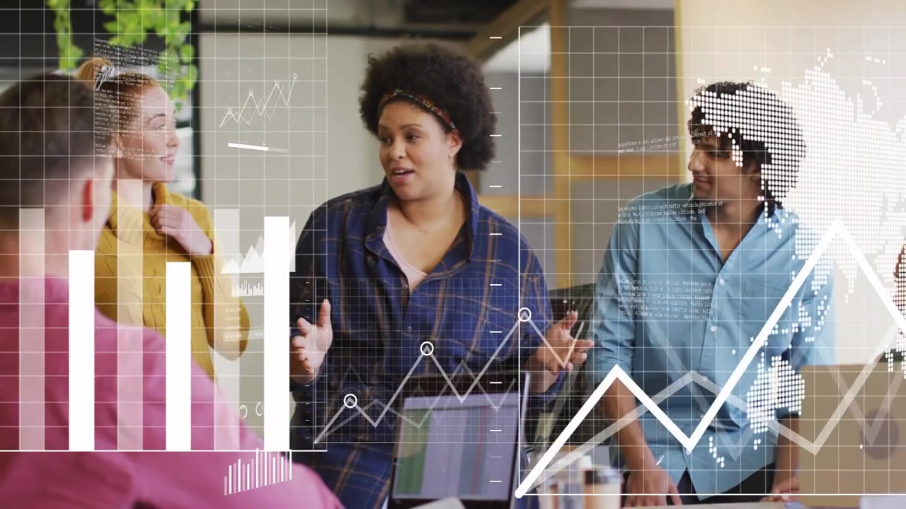Presenter stepping forward and explaining project data, business charts appearing over laptops