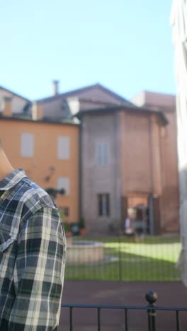 man in plaid shirt outdoors