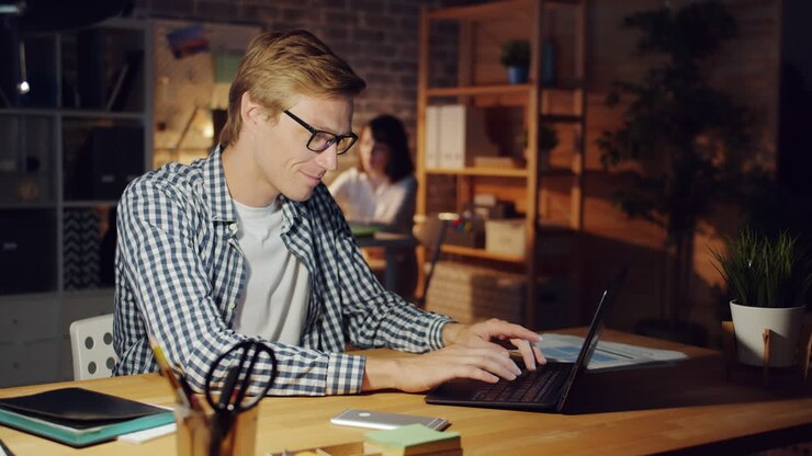 Man Working Late at Night in Office