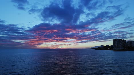 dramatic view of cloudy sunset or sunrise over the sea