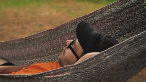 man resting in hammock