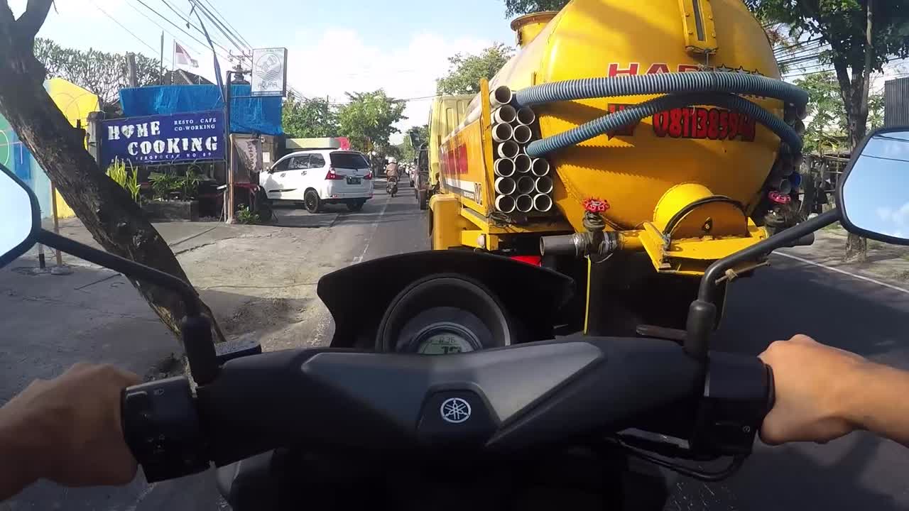 Motorcycle ride through city traffic